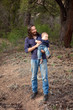 Father and son having fun in the forest Father and son having fun in the forest