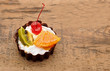 fresh baked cupcake on a dark wooden background fresh baked cupcake on a dark wooden background