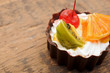 fresh baked cupcake on a dark wooden background fresh baked cupcake on a dark wooden background