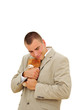 Young man in office suit with an old toy