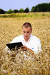 Agriculture scientist in the field taking notes