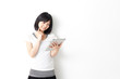 attractive asian woman using tablet computer