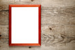 Old photo frame on wooden background