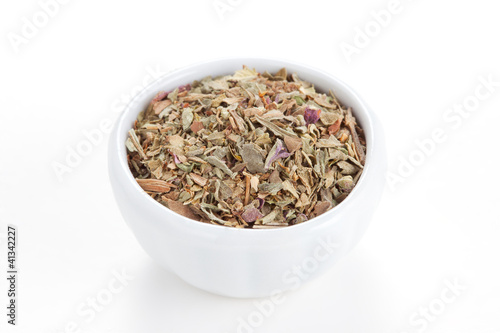 Photo: Ground dried Basil (Sweet Basil) in a white bowl on white backgr Ground dried Basil (Sweet Basil) in a white bowl on white backgr