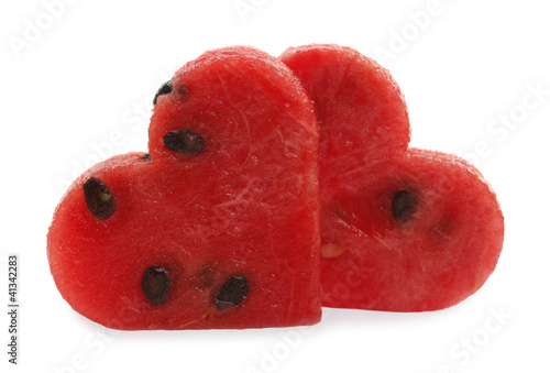 Photo: Watermelon two slices cut as heart shape Watermelon two slices cut as heart shape