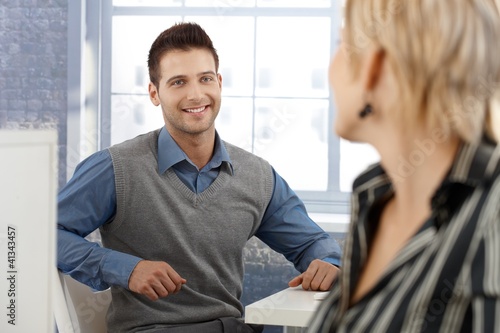 Photo: Coworkers chatting Coworkers chatting