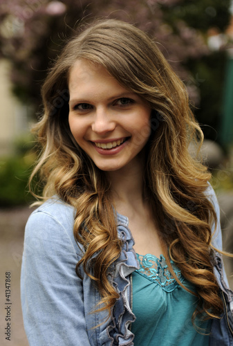 Photo: portrait of a young woman outdoors portrait of a young woman outdoors