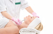 A young woman laying on a plastic surgery procedure