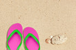 pink and green flip flops on the beach with space pink and green flip flops on the beach with space