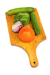 Pepper, onion, cucumber, tomato  and kitchen knife on a desk