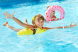 Children sitting on inflatable ring.