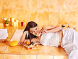 Woman relaxing in bathroom.