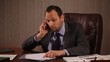 Video: Angry boss talking on the phone in office Angry boss talking on the phone in office