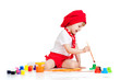 small artist child painting with brush
