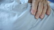 a man tries to ease the pain in his shoulder