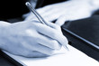 Photo: Woman hand writing Woman hand writing