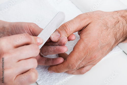 Photo: Manicure man close-up Manicure man close-up