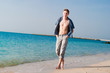 strong young man at beach strong young man at beach