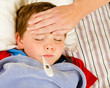 Sick child being checked for fever