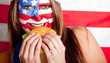 Photo: American woman eating hamburger American woman eating hamburger