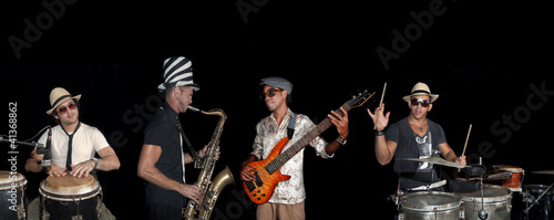 Photo: Four musicians performing isolated over back Four musicians performing isolated over back