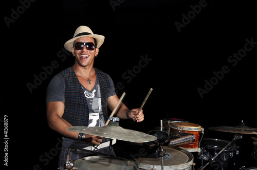 Photo: Cuban percussionist isolated on black Cuban percussionist isolated on black