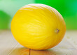 Yellow melons on wooden table