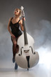 Young Woman In Lingerie With A Double Bass