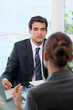 Photo: Businessman looking at his client Businessman looking at his client