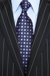 Black pinstripe suit and tie