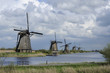windmills before storm, kinderdijk, netherlands