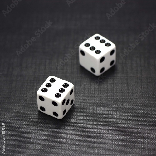 Photo: Dices on a black background Dices on a black background