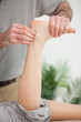 Masseur holding a tendon