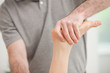 Physiotherapist manipulating the ankle of a patient
