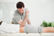 Man pressing the back of a woman with his elbow