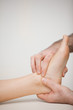 Doctor massaging the side of a foot