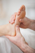 Foot receiving a massage by a physiotherapist