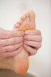 Barefoot being massaged by a physiotherapist