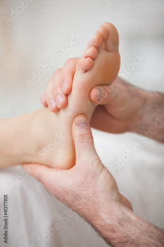 Photo: Foot receiving a massage by a physiotherapist Foot receiving a massage by a physiotherapist