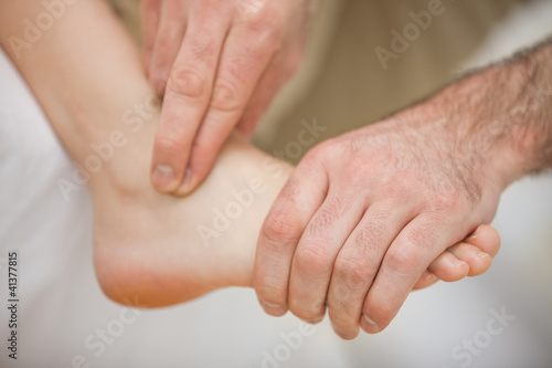 Photo: Physiotherapist massaging a barefoot Physiotherapist massaging a barefoot