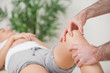 Photo: Practitioner using his fingers to massage a knee Practitioner using his fingers to massage a knee