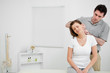 Doctor examining the neck of his patient while standing