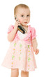 Little girl talking on the phone in a pink dress