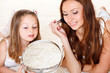 Foto: Happy woman and preschool girl Happy woman and preschool girl
