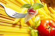 spaghetti macaroni tomatoes and basil