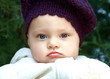 Funny baby in hat outdoors with chubby bright lips and cheeks Funny baby in hat outdoors with chubby bright lips and cheeks