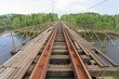 Old railway bridge over a lake. Old railway bridge over a lake.