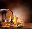 Beer barrel with beer glasses on a wooden table.