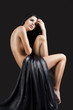the nude cute sexy woman over black, she looks up