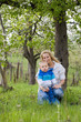 Cute kid with his mom outdoors in nature.
